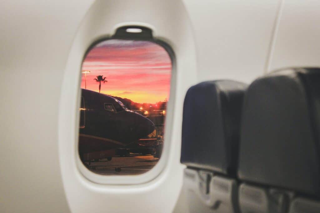 View of tropical sunset from an interior airplane window.